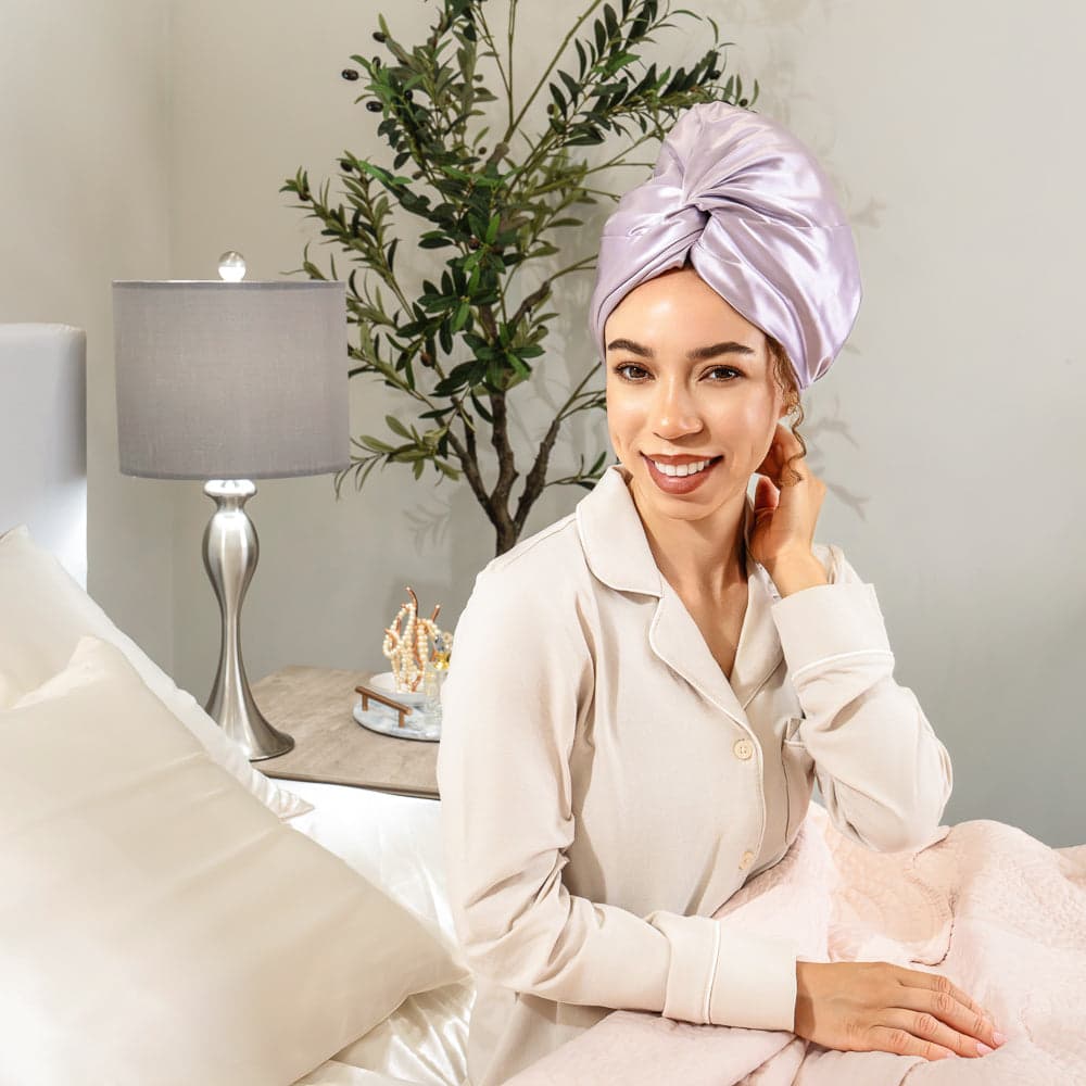A creator wearing a lavender silk bonnet and a cozy robe